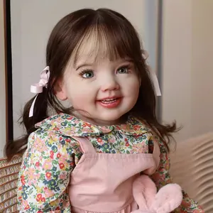 Realistic 70cm Cammi reborn toddler doll with floral dress and pigtails smiling