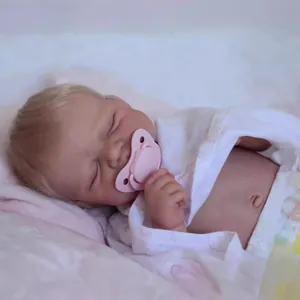 Lifelike 50cm sleeping reborn baby doll with realistic skin and soft purple swaddle