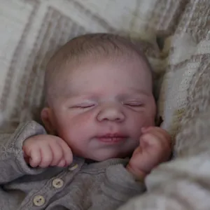 Lifelike 19-inch reborn baby doll in sleeping pose with grey knitted onesie outfit
