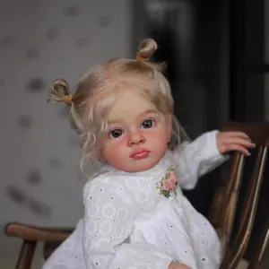 Poupée Reborn réaliste de 60cm Tutti avec tresses blondes et robe en dentelle