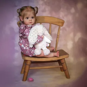 Detailed realistic Maggi toddler doll wearing a purple floral dress with a plush rabbit