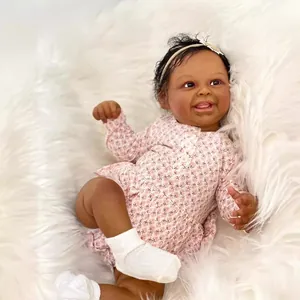 Poupée bébé reborn réaliste de 50 cm en tenue fleurie rose avec un bandeau assorti