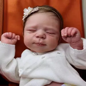 Poupée reborn réaliste de 19 pouces endormie avec gilet blanc et bandeau fleuri