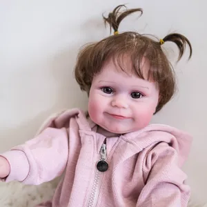Lifelike 50cm Maddie reborn doll with rooted brown hair in pink hooded jacket