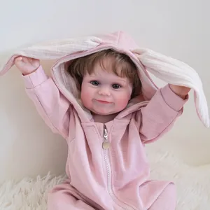 50cm lifelike reborn baby doll Maddie wearing a pink rabbit hooded romper on plush rug