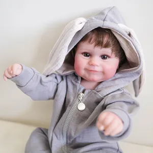 50cm lifelike reborn baby Maddie doll with rooted hair in a grey bunny ear romper outfit