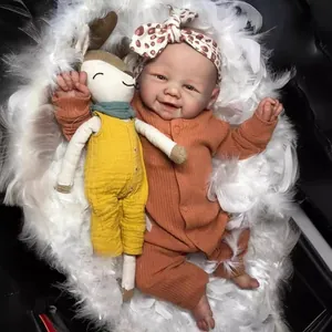 Close-up of lifelike 19-inch reborn doll with realistic skin texture and bunny plush toy