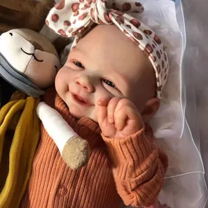 Realistic 19-inch reborn baby doll Vivienne with detailed 3D skin and orange jumpsuit