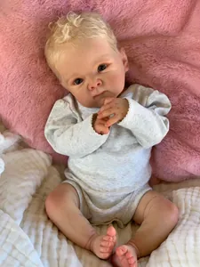Detailed view of 18-inch lifelike reborn baby doll with realistic skin and blonde hair