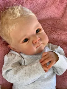 Close-up of the 18 inch Reborn Doll with realistic skin texture and blonde curly hair