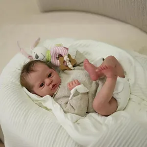 Detail of 19 inch lifelike reborn baby doll with visible skin veins and knitted outfit