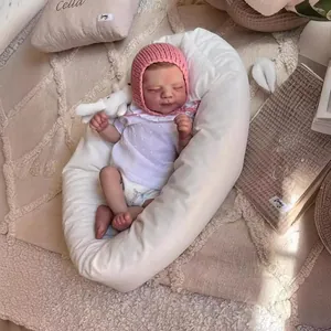 50cm lifelike newborn reborn baby doll in pink knit hat sleeping on white crescent pillow