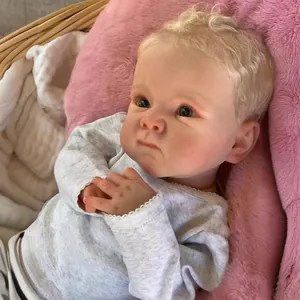 Lifelike 18-inch reborn baby doll Bettie with blonde curls and grey striped lace outfit