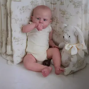 Realistic 60cm reborn baby doll Cameron in off-white romper with accessories
