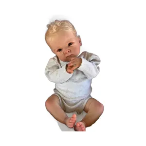 Realistic 18-inch Bettie reborn baby doll with blonde curls and grey long-sleeved romper