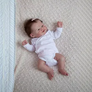 Detailed close-up of 19-inch reborn baby doll sleeping with lifelike facial skin textures