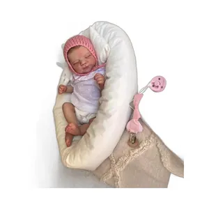 50cm realistic reborn baby doll with pink knit hat and matching nursing pillow