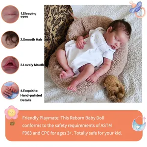 Realistic 18-inch reborn baby doll sleeping in white textured outfit with lifelike details
