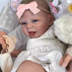 22-inch Hani reborn doll with realistic skin and white lace dress on floral background