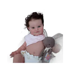 Lifelike 50cm reborn baby doll Maddie with brown rooted hair and soft rabbit plush
