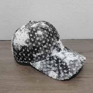Distressed black and white tie-dye baseball cap with sparkling silver sequins and frayed edges