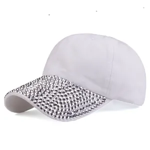 White cotton baseball cap for women featuring a stylish silver rhinestone brim