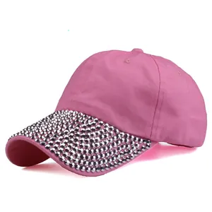 Detail of pink cotton baseball cap with sparkling silver rhinestones on the brim