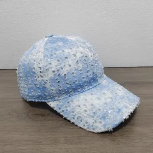 Detail of blue and white sequins baseball cap with vintage distressed denim texture