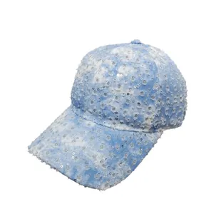 Distressed light blue denim baseball cap with silver sequins and ripped vintage texture