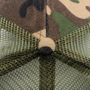 Close-up of a jungle camouflage mesh trucker hat showing top button and stitching detail