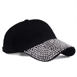 Black baseball cap with shiny rhinestones on the brim, stylish sun protection for women