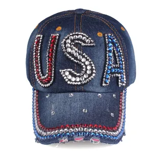 Macro detail of USA crystal rhinestones and sequins on navy blue denim baseball cap