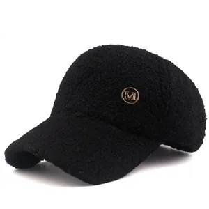 Women's black faux shearling baseball cap with golden M logo for winter warmth