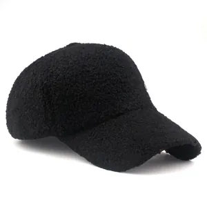 Winter faux shearling baseball cap for women with M logo in black textured teddy fleece