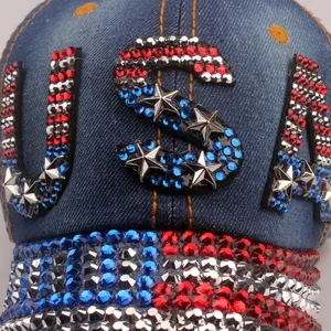 Navy blue denim baseball cap featuring USA rhinestone lettering and metallic stars