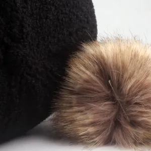 Black sherpa baseball cap for women with brown faux fur pom-pom and M logo detail
