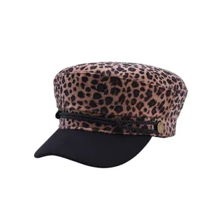 Women's leopard print baker boy hat with black brim and vintage metal buttons
