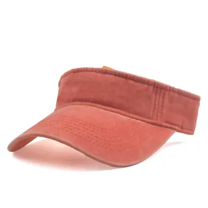 Detail view of red washed cotton sun visor with parallel reinforced stitching on brim