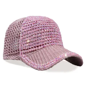Close-up of pink mesh baseball cap featuring luxury rhinestones and breathable knit structure