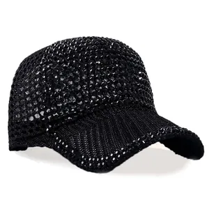 Close-up of black mesh baseball cap with sparkling rhinestone embellishments and brim texture