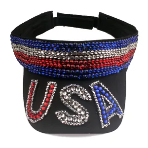 Detail of USA rhinestone design on black sun visor hat with red white and blue crystals