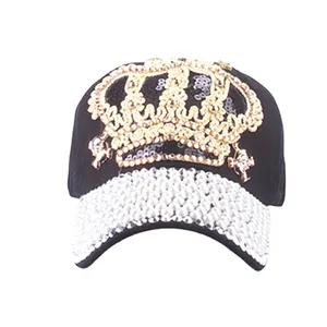Luxury black baseball cap featuring a gold crown sequin patch and pearl-studded brim