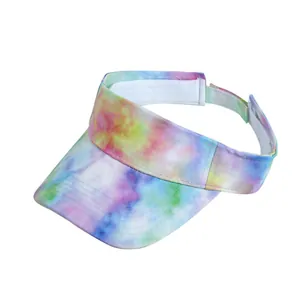Detail of colorful tie-dye sun visor with stitched brim and adjustable velcro strap