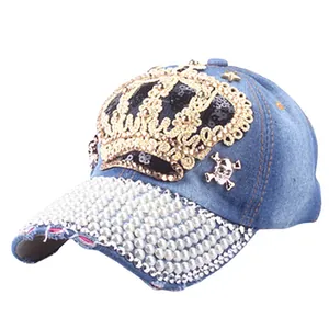 Blue denim baseball cap with pearl brim, gold crown and metal skull badges