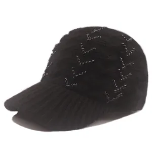 Detailed view of black knitted baseball cap featuring elegant rhinestone embellishments