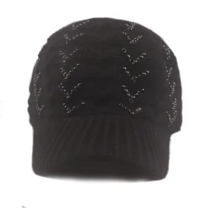 Close-up of black knitted beanie featuring elegant V-shaped rhinestone embellishments