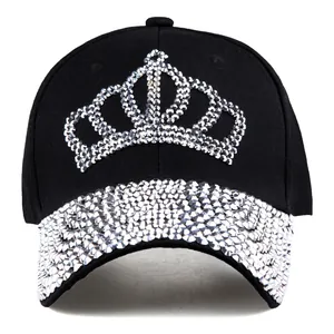 Close-up of a black baseball cap with silver rhinestone crown pattern and studded brim