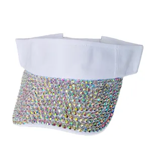 Close-up of sparkling AB rhinestones on the brim of a white sun visor baseball hat