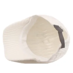 Detail of white knit baseball cap showing inner sweatband and adjustable back strap