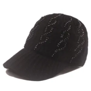 Close-up of black knitted baseball cap featuring wavy rhinestone bead decorations